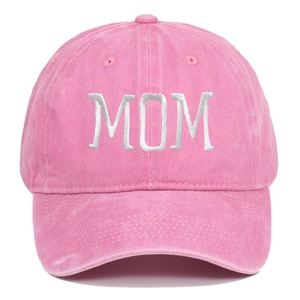 Close-up of white MOM embroidery on pink washed cotton baseball cap with fabric texture