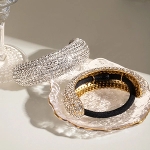 Detail of luxury rhinestone hair ties with gold and silver crystal inlaid bases