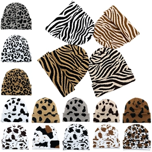 Knitted beanies set with cow, leopard and zebra prints in black, brown and white colors