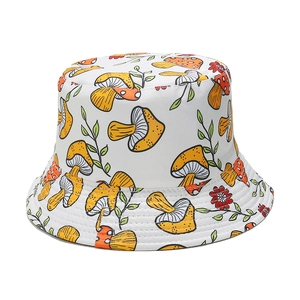 Detail of white bucket hat with yellow mushroom prints and reinforced brim stitching