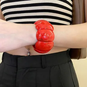Chunky red acrylic geometric bangle bracelet with high-gloss modular sphere design for women