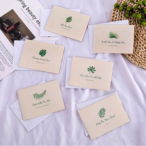Detailed flat lay of 6 botanical greeting cards with white envelopes and leaf patterns