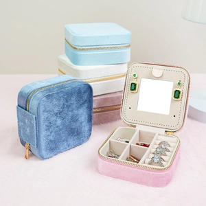 Portable velvet jewelry travel case with mirror and multi-slot storage in pastel colors
