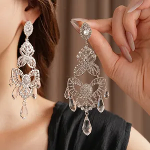 Elegant silver tassel flower drop earrings with sparkling rhinestones in vintage style