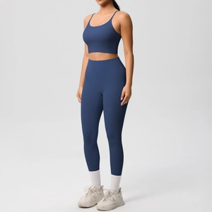 Detail view of navy blue two-piece yoga set with U-neck sports bra and high-waist leggings