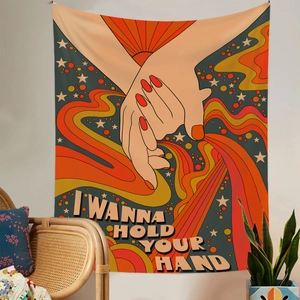 Detail of retro pop tapestry featuring I Wanna Hold Your Hand text and sunburst design