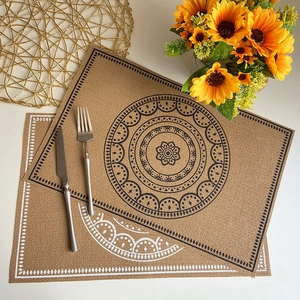 Faux jute placemats with black and white mandala patterns for boho dining decor