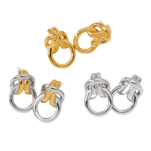 Three pairs of interlocked knot earrings in gold, silver, and dual-tone polished finishes