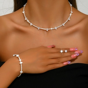 Elegant bridal jewelry set with pearl and zircon necklace, bracelet and earrings