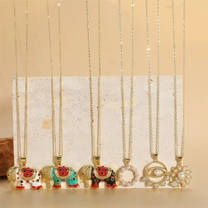 14K gold plated necklaces featuring zircon elephant charms and pearl solar pendants