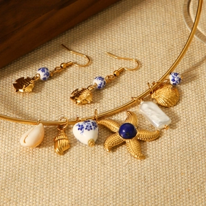 Golden ocean necklace and earrings set with shell pearl and ceramic heart pendants