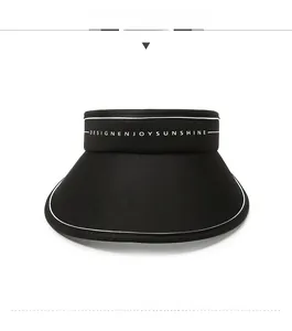 Detail of black visor hat with white piping and DESIGNENJOY SUNSHINE lettering print