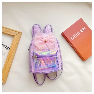 Detail of purple sequin girls backpack featuring bunny ears and a pink mesh bow detail