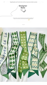 Close-up of five green and ivory twilly scarves with floral and geometric patterns