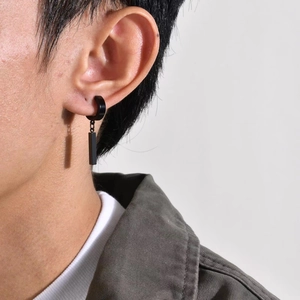 Unisex black stainless steel hoop earring with minimalist rectangular pendant on model