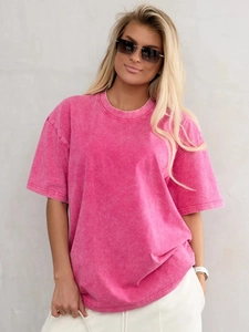 Detail view of pink acid wash oversized cotton t-shirt featuring retro vintage texture