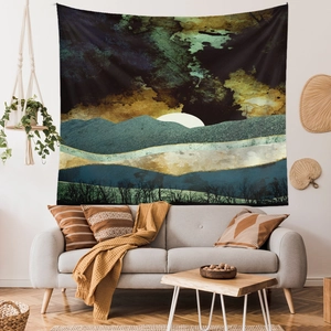 Close-up of a nature-themed wall tapestry featuring layered green mountains and a full moon