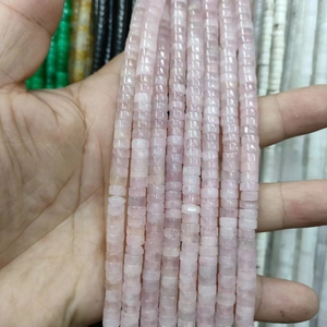 Macro shot of 3x6mm flat round pink natural stone spacer beads for jewelry making
