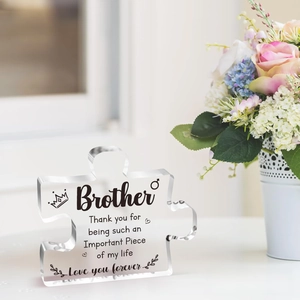 Macro detail of acrylic puzzle piece for brother with elegant black printed text