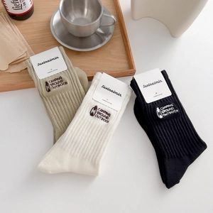 Three pairs of combed cotton crew socks with outdoor camping embroidery in khaki, white and black