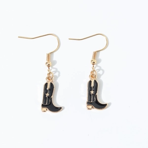 Detailed macro view of Western boot earring charm with black enamel and gold star