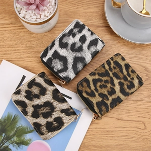 Set of three leopard print accordion card holders in black, brown and beige tones