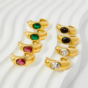 Polished C-shaped gold-plated stainless steel earrings with oval colored gemstones set