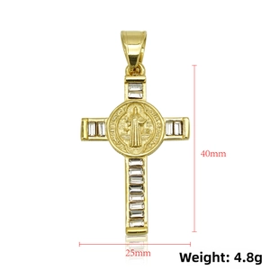 Macro detail of a 316 stainless steel St. Benedict cross pendant with baguette-cut CZ stones