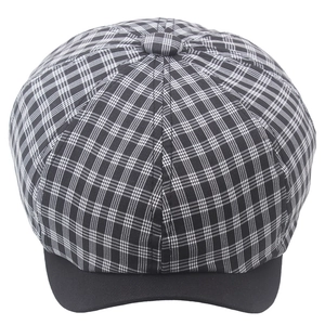 Vintage checkered newsboy cap for women with black brim in a classic retro style