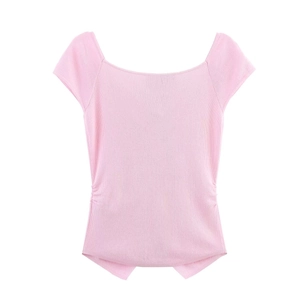Detailed view of pink knitted top featuring ruched side drawstrings and U-neckline design