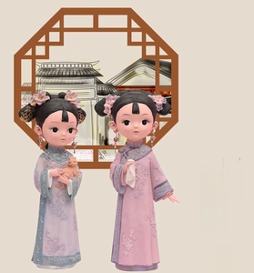 Close-up of Qing Dynasty girl figures with pink embroidery and floral headpieces