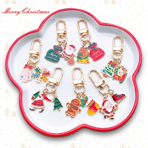 Christmas enamel keychain set with Santa, gingerbread man and tree charms in gold finish