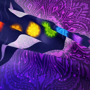 Detailed close-up of vibrant seven Chakra symbols on a purple spiritual wall hanging tapestry