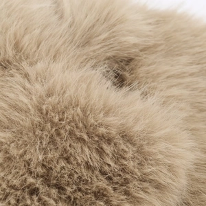 Detailed close-up showing soft texture of camel faux fur jacket with fluffy long pile fibers