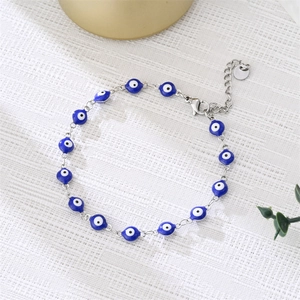 Detail of the blue evil eye beaded bracelet with silver lobster clasp and extension chain