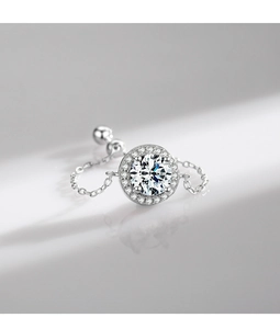 Macro shot of silver S925 chain ring with round gemstone and halo cubic zirconia details