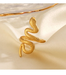 Macro detail of 18K gold-plated snake ring with fine scale texture on beige satin
