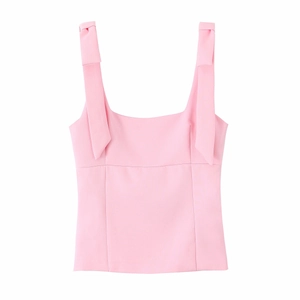 Detailed close-up of pink elastic tank top featuring a wide strap and neat bow ornament