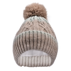 Detail of cable knit beanie with thick white fleece lining and fluffy faux fur pompom