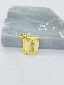 Macro detail of a gold-plated heart photo locket with sparkling zircon crystal inlay