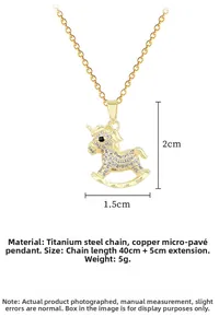 Detail of gold unicorn pendant necklace showing 2x1.5cm size and crystal pavé setting