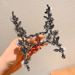 Exquisite metal flower hair claw clip with camellia design and branch leaf motifs