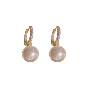 Elegant gold earrings with micro-pave zircon crystals and large hanging round pearls