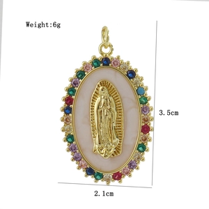 Detailed view of Virgin Mary pendant with gold finish and colorful crystals measuring 3.5cm