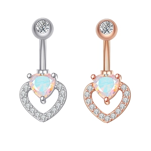 Detailed view of silver and rose gold heart navel rings with iridescent stones and cubic zirconia