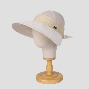 Women's beige wide brim sun visor with elegant bow tie and metal plaque detail