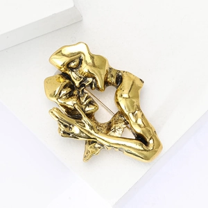 Artistic gold-plated alloy brooch featuring an abstract kissing lovers design for clothing
