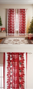 Detail of Christmas curtain fabric with snowman and snowflake prints in red and white