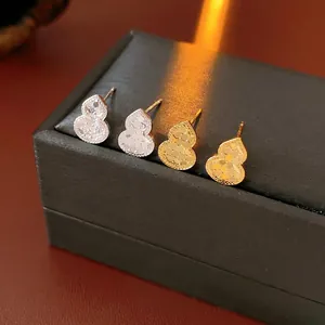 Luxury 18k gold plated wulu stud earrings with faceted surface in gold and silver