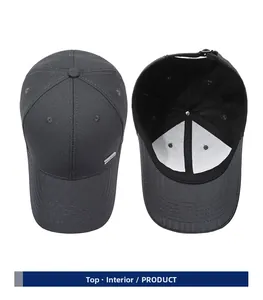 Top and interior detail of dark grey baseball cap with adjustable metal strap and side plaque